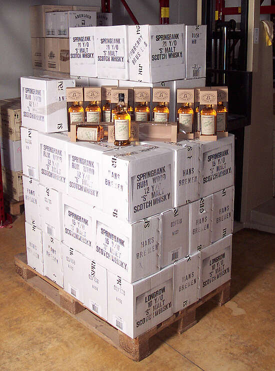 A pallet that has many boxes on it that are labeled "Springbank"