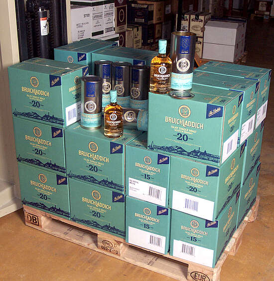 a pallet of Bruichladdich 20 years and a few bottles on top of it.